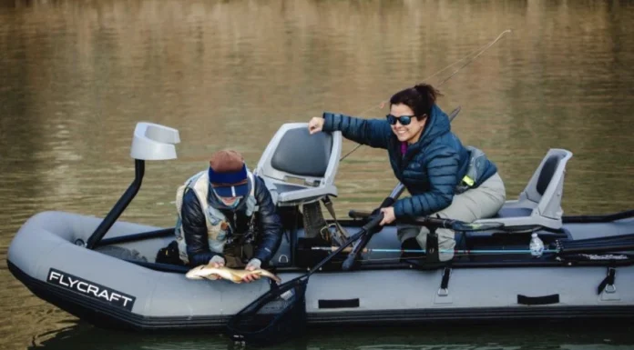 Fly Fishing New Mexico with Trisha Valdez – Small Streams to Big Tailwaters Trisha Valdez landing a trout from a Flycraft boat while fly fishing New Mexico