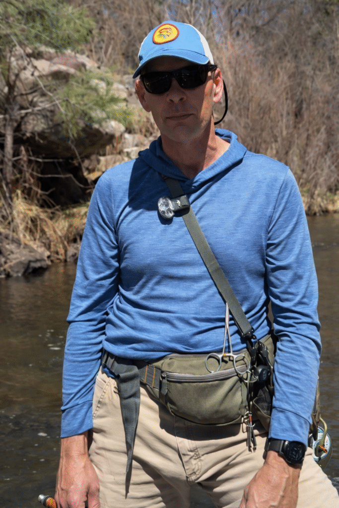Gary Davis standing in a New Mexico river discussing choosing the right fly rod