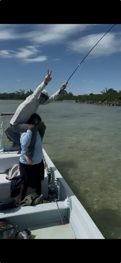 Two anglers on a flats skiff in shallow water fly fishing in Mexico