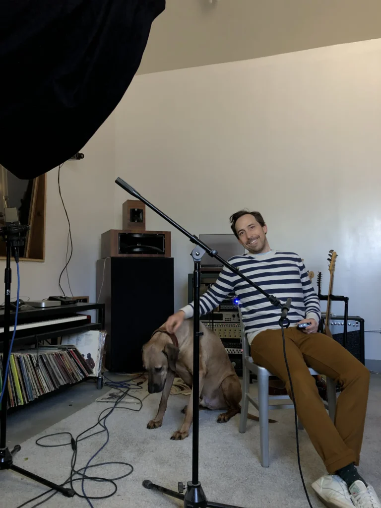 Pablo Signori recording a podcast in his home studio with microphone and audio equipment