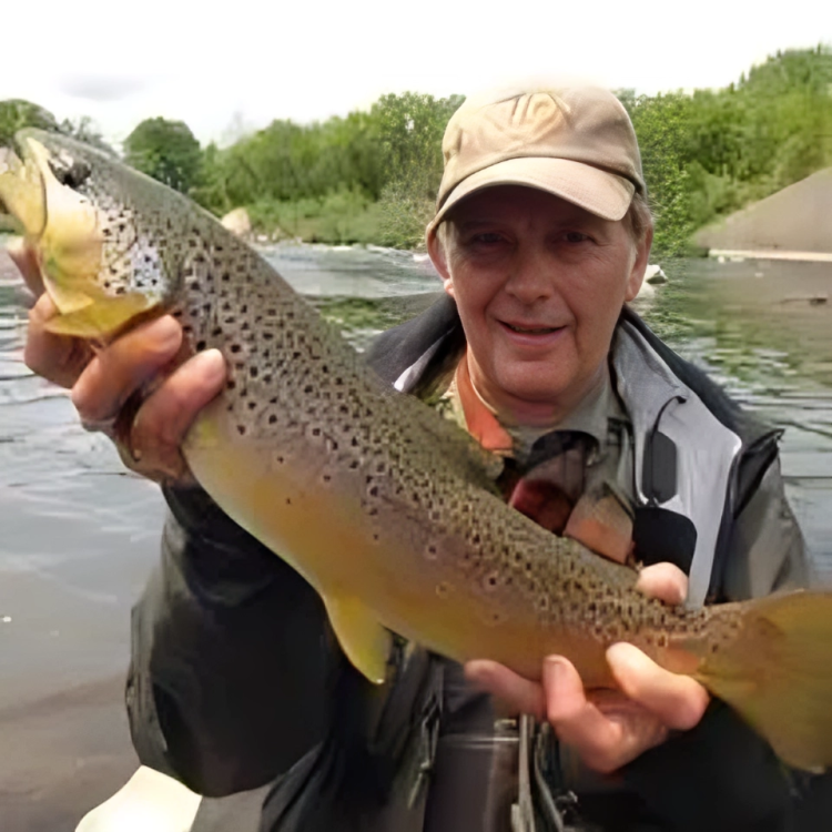 Davy Showing off the trout he caught using his traditional wet fly swing approach.