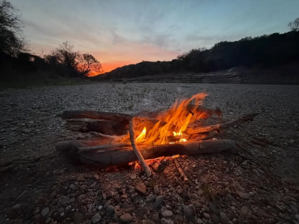 Camp fire set up and discussing Texas Fly Fishing